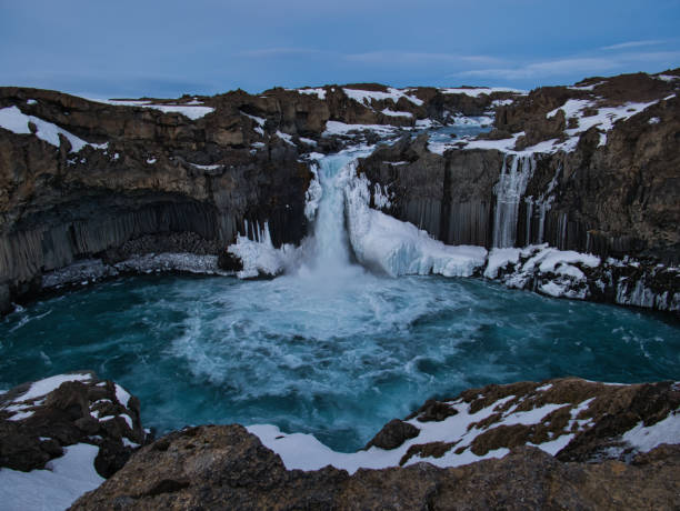 istock Basalt stones and the blue Aldeyjarfoss waterfall 1183073471