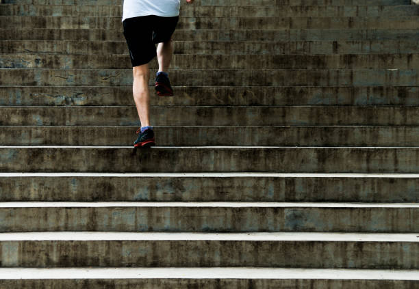 istock Man running up outdoor stairs 1183074678