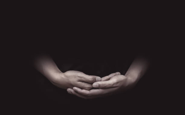 praying hands concentrating attentively and meditation on beliefs or hope background. gestures of hands and mourning with soul. - attentively imagens e fotografias de stock
