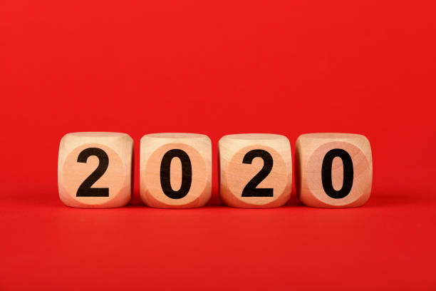 istock Wooden cubes with 2020 word over red 1183076833