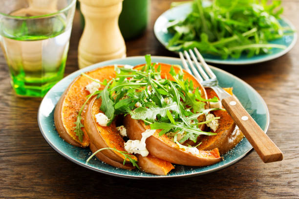 istock Baked pumpkin with feta and herbs. Selective focus 1183078073