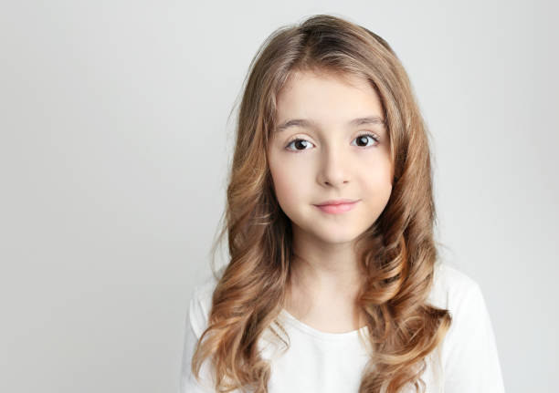 istock Caucasian child girl portrait on grey background empty copy space. 1183078222