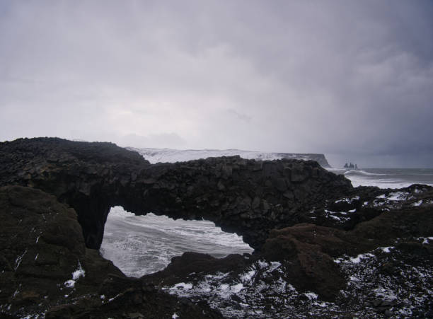 istock View through a rockhole to the coast of Iceland 1183078286