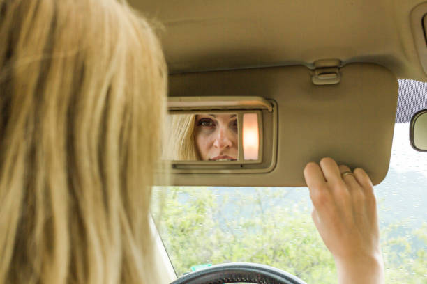 istock Beautiful young woman in a car 1183078473