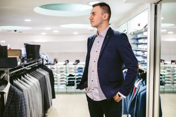 istock Man buying suit 1183079630