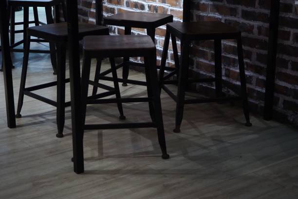 istock Chair in front of brick wall 1183082154