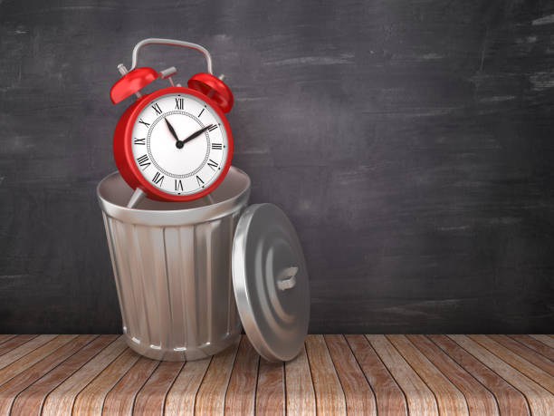 istock Trash Can with Alarm Clock on Chalkboard Background - 3D Rendering 1183086133