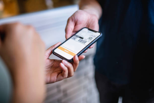 istock Recipient Providing Delivery Driver with Digital Signature 1183087660