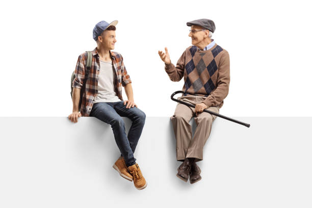 istock Young guy sitting on a panel and listening to his grandfather 1183088003