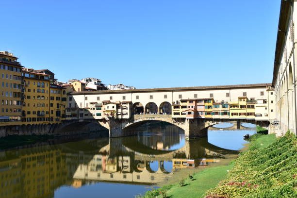 istock Ponte Vecchio and Arno River with blue sky. Florence, Italy. 1183088140