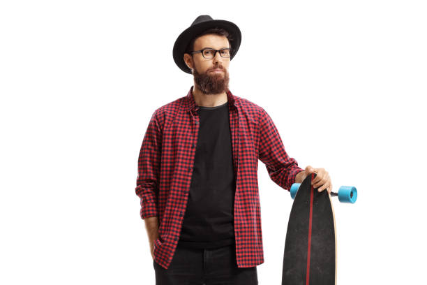 istock Male hipster standing and holding a longboard 1183088142