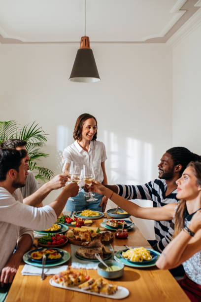 istock Pretty Woman Hosting Party at Home 1183090148