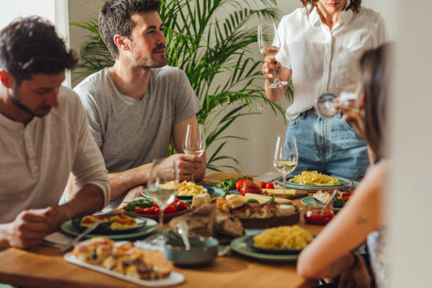 istock Friends Enjoying Dinner Party 1183090751
