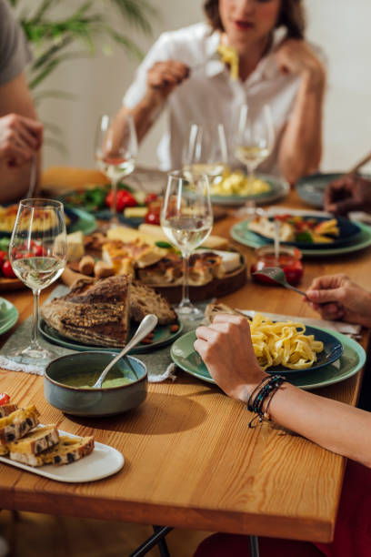 istock Group of People Having Delicious Dinner 1183090754