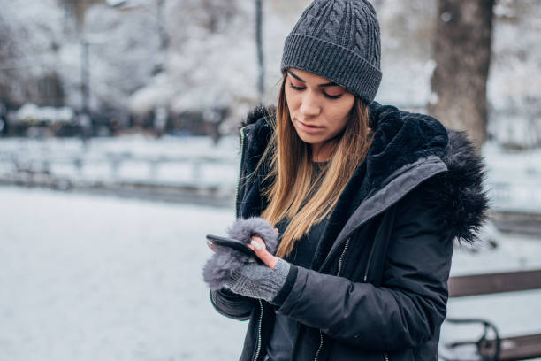 istock Young girl texting at the park 1183091469