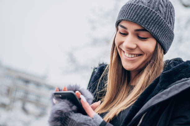 istock Young girl texting at the park 1183091498