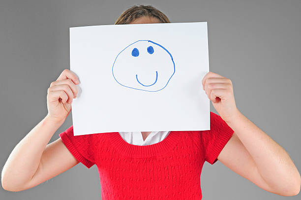 istock Child Holding Face Sign 118309291