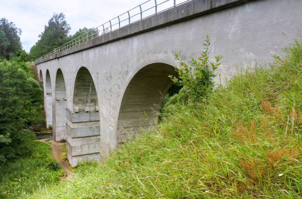 istock high railway bridge over the river, old arch bridge 1183094554