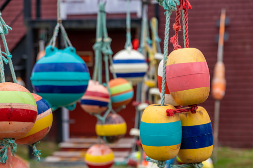 Painted buoys hanging up