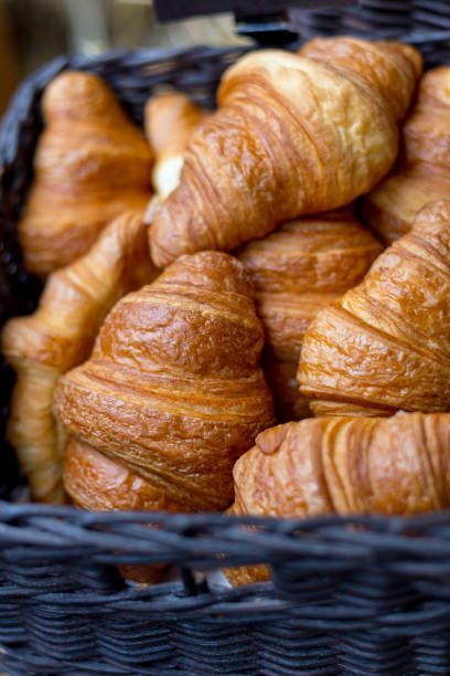istock Croissants in a basket close-up 1183095537
