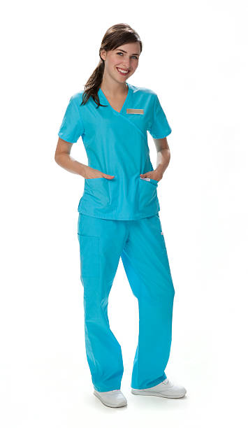 Young smiling woman in blue scrubs stock photo