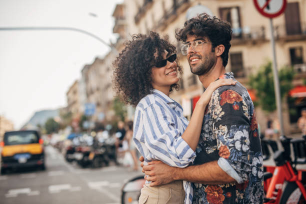 istock Young couple hugging on the street 1183098003