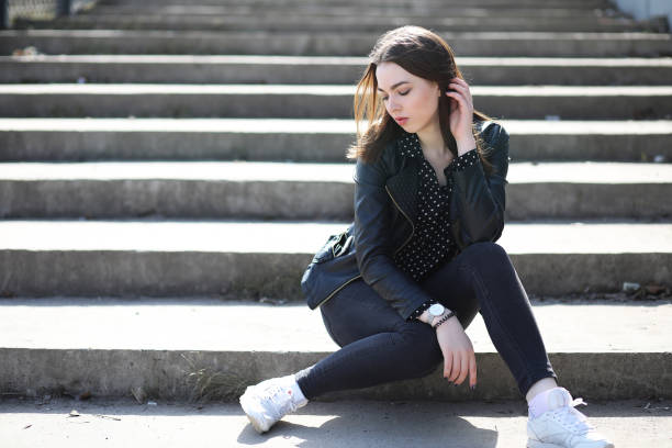 istock Girl on a walk through the spring city 1183102219
