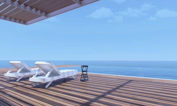 istock 3D image from an house with pool, sun beds at side of. 1183102398