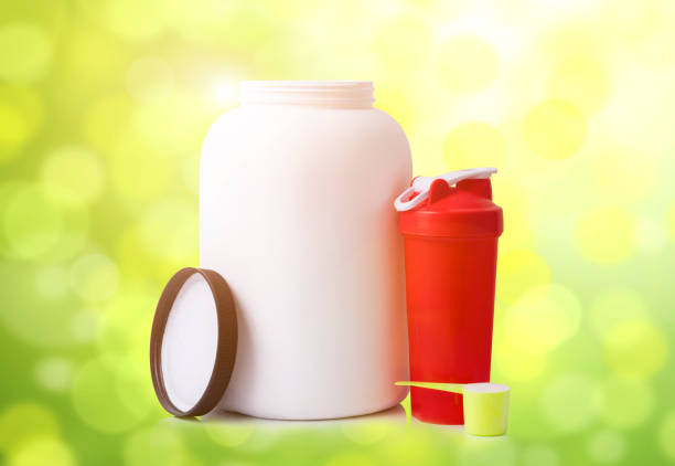 istock Protein nutrition supplement containers and shaker, scoop 1183103049