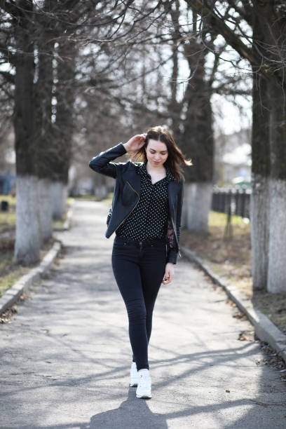 istock Girl on a walk through the spring city 1183103056