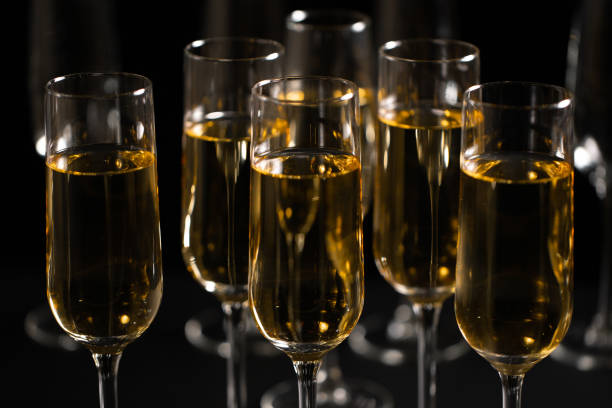 istock Champagne flute and bottle on Black background 1183103698