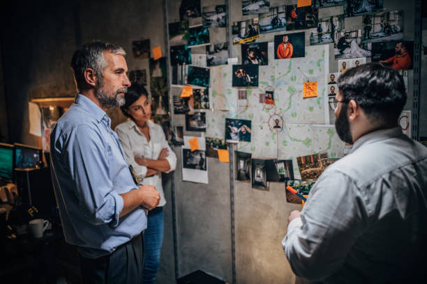 istock Detectives looking for clues together in office 1183103721