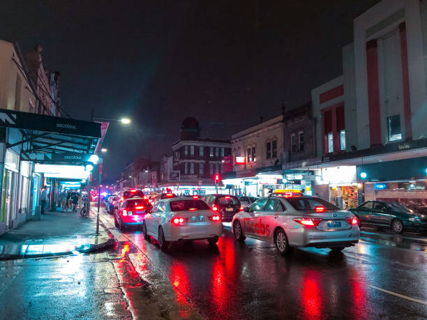 Rainy night Sydney, Australia - September 6, 2019: Traffic at Newton on a rainy night. newtown stock pictures, royalty-free photos & images