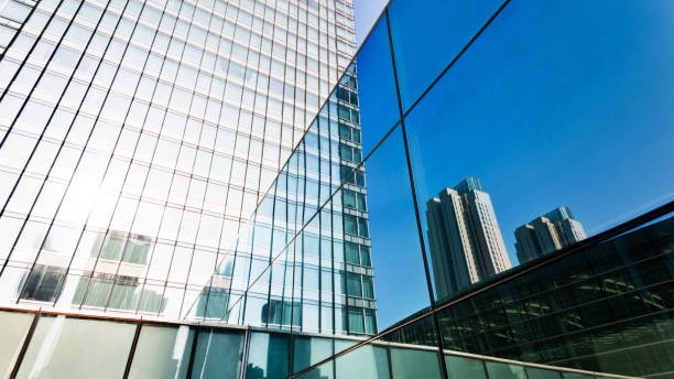 istock Modern building is reflecting on the glass wall 1183104154