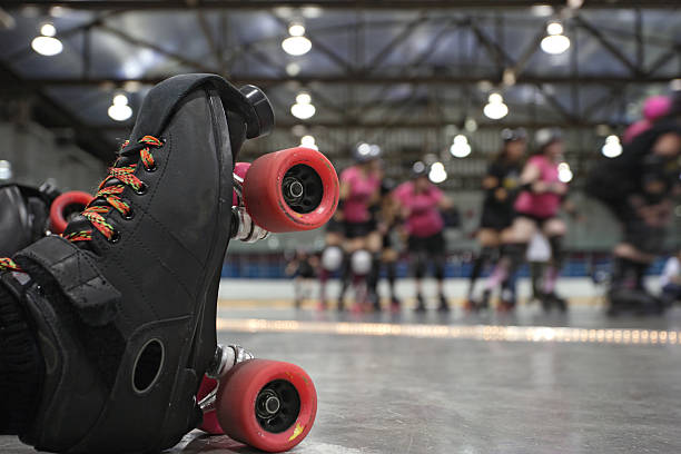 Roller derby skater fall stock photo