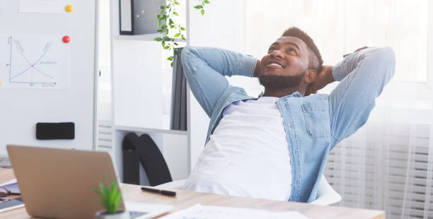 istock Satisfied office worker leaning on chair, relaxing after completed job 1183105812