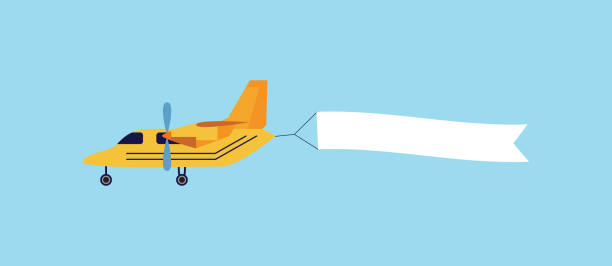 istock Vintage yellow airplane flying with blank white ribbon banner behind it 1183106131