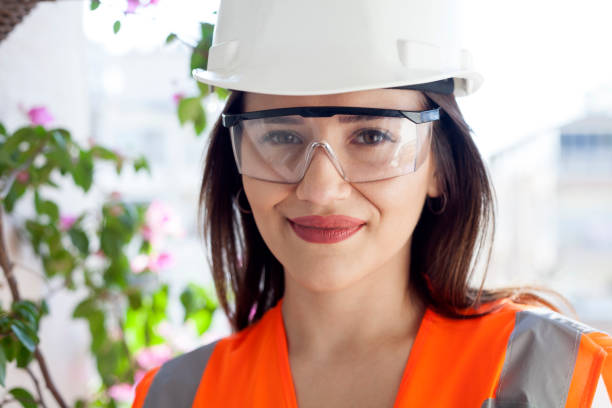 istock engineer woman  in yellow helmet 1183107863