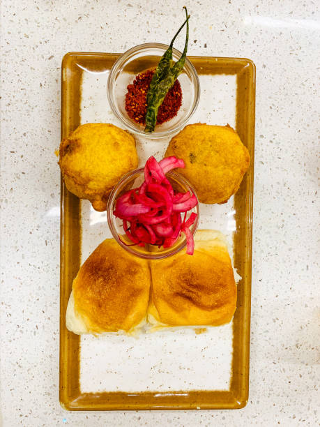 vada pav platter - cooked vertical high angle view lentil imagens e fotografias de stock