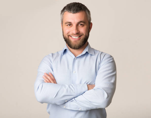 istock Portrait of confident bearded man over white background 1183109853