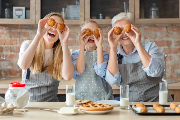 istock Positive female family having fun at kitchen 1183110029