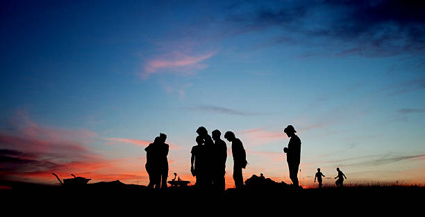 Team at sunset stock photo