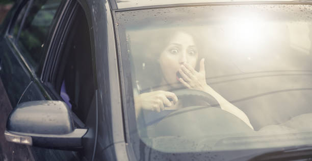 istock Girl driving a car bad emotions 1183111372