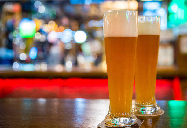 istock two glass of light beer stands on a table in a bar or pub 1183114075