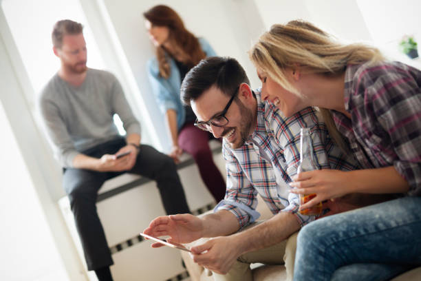 istock Young couple at home websurfing on internet 1183115528