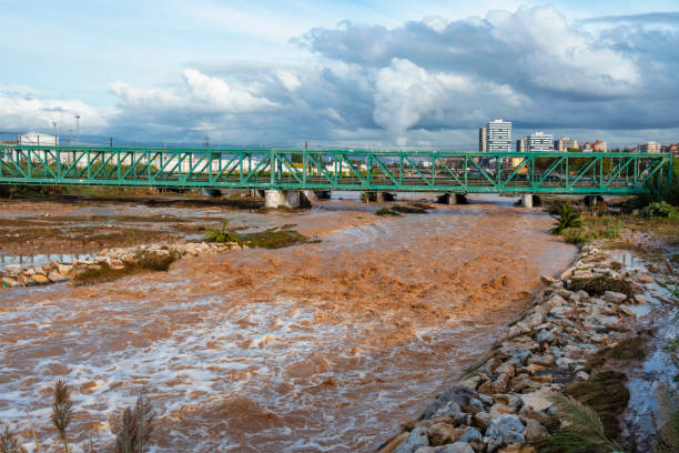 Valencia, Spain - October 31, 2024: The resulting effect of Storm DANA. Cars and other vehicles stacked upturned as effects of torrential flood in Valencia, Spain