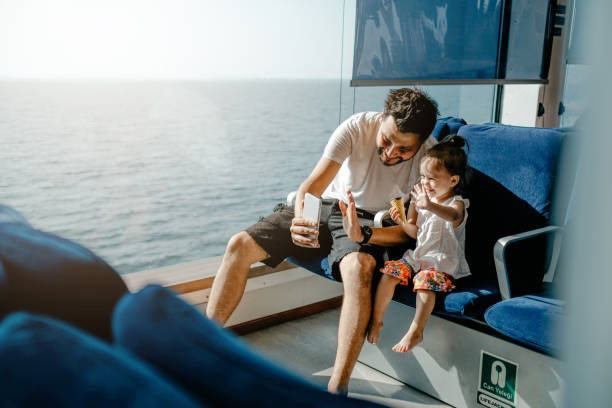 istock Father with daughter taking selfie 1183118396