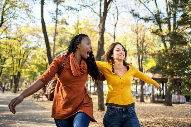 istock Multi ethnic friends in the autumn park 1183119484