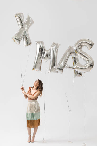istock Beautiful Woman Celebrating Christmas 1183120049
