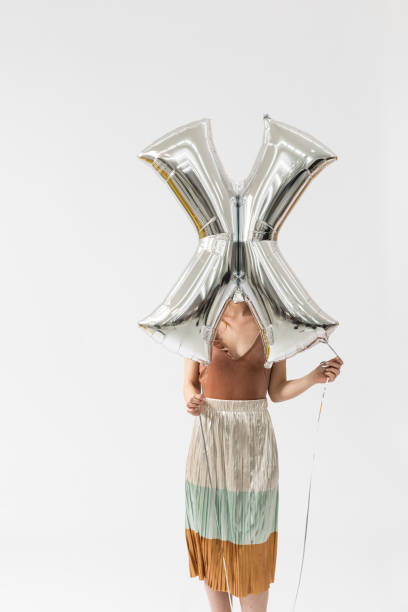 istock Stylish Woman Holding Helium Balloon 1183120066